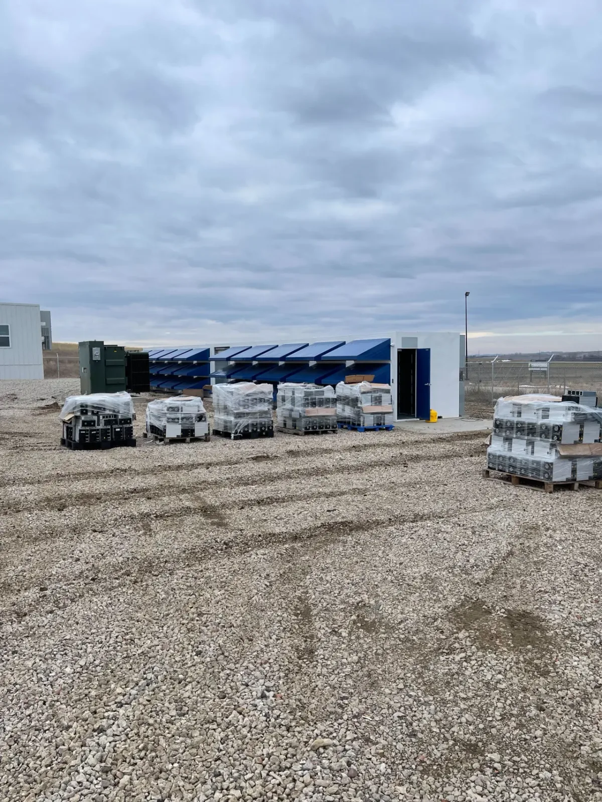 Mining containers and staged ASIC hardware arriving at the new 5 MW site